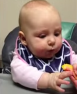 Baby_surprised_by_taste_of_peach.png