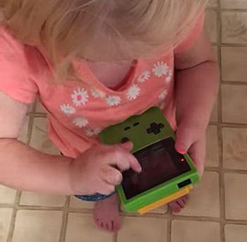 Trying_to_play_Gameboy.jpg
